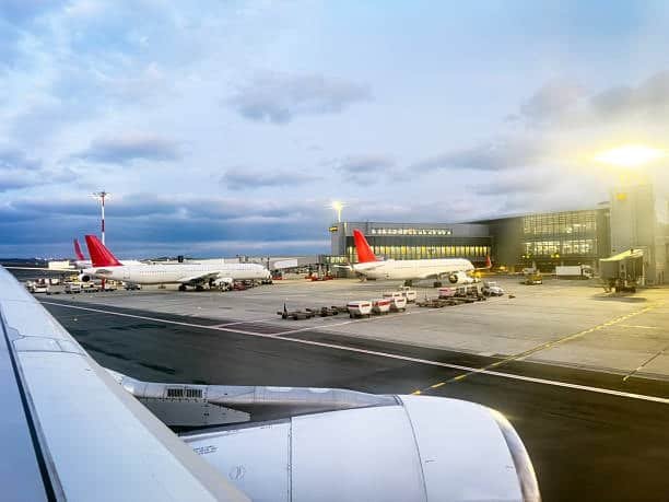 Aircraft at an international airport terminal, highlighting air cargo from Germany to the USA