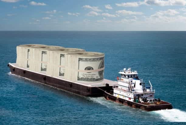 Tugboat pulling a barge loaded with dollar symbols, representing low-cost freight value