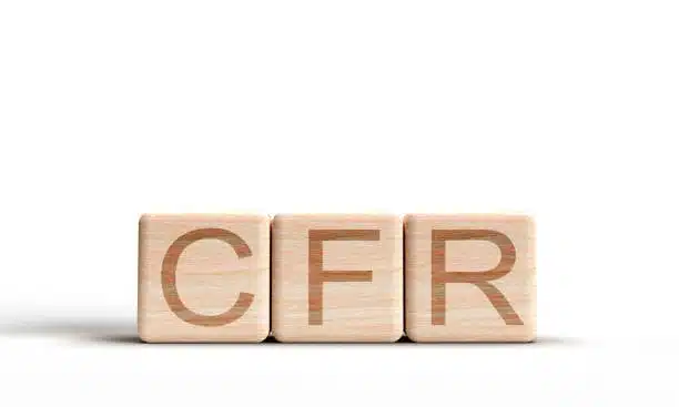 CFR incoterm written on wooden cubes representing international shipping terms