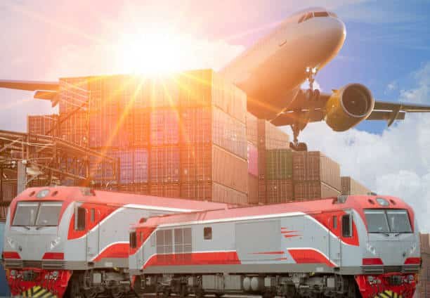 Cargo train and airplane with stacked containers in background, representing rail and air freight to Greece