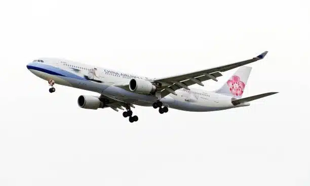 China Airlines cargo aircraft flying through the sky, representing international air freight logistics from China