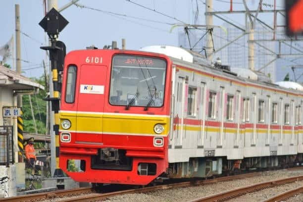 Regional commuter or freight train on track representing inland transportation in Asia