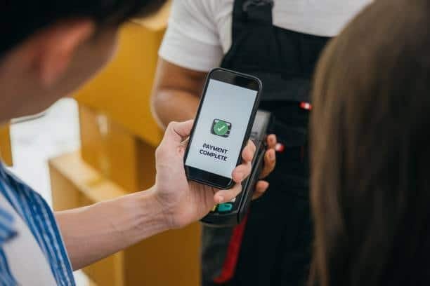 Payment confirmation on mobile screen during a shipping delivery process