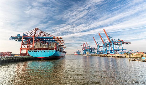 Port cranes at a German container terminal loading ships for transatlantic shipping