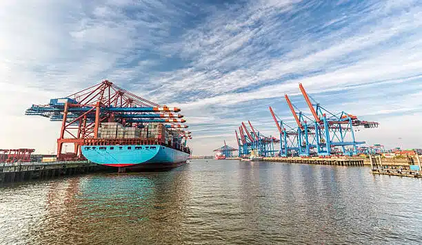 Port cranes at a German container terminal loading ships for transatlantic shipping