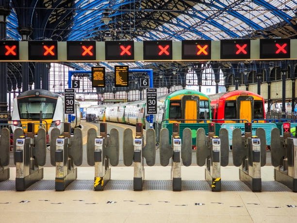 International train station with gates and freight trains representing export shipping
