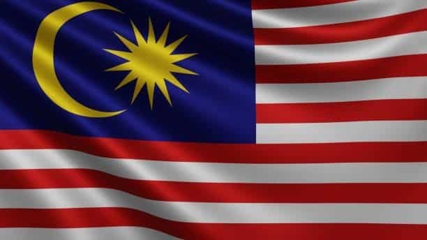 A waving Malaysian flag, symbolizing the country’s role in global trade and exports