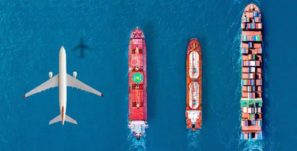 Airplane flying above cargo ships in ocean, highlighting international sea and air shipping to Tanzania