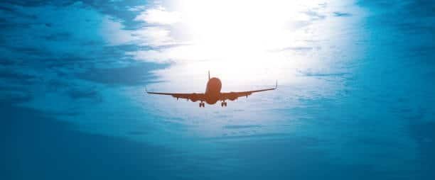Silhouette of a cargo aircraft flying during sunrise, symbolizing fast and reliable air freight shipping from China