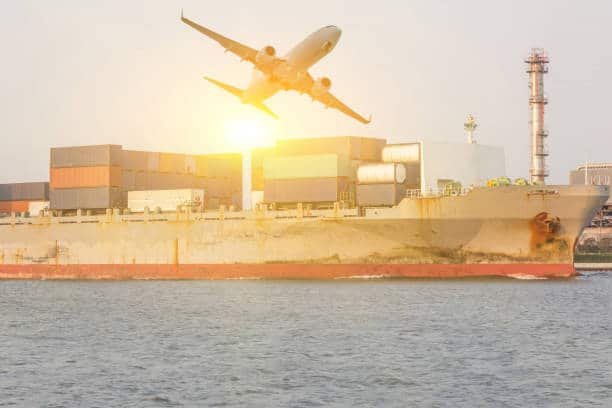 Cargo ship and airplane at sunset symbolizing multimodal shipping from China to Hungary.