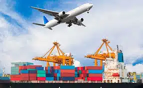 Airplane flying over a port with cargo containers, representing multimodal shipping to Jordan.