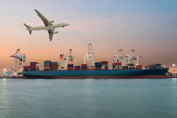 Cargo ship at port with airplane above, symbolizing air and sea freight from China to South Africa