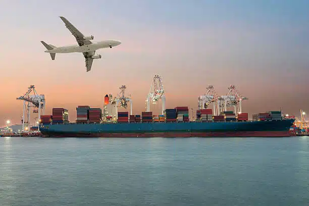 Cargo ship at port with airplane above, symbolizing air and sea freight from China to South Africa