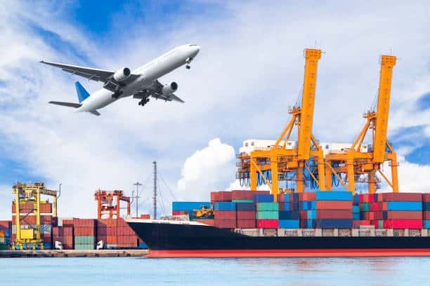 Airplane taking off above cargo cranes and containers, showing air-sea shipping services to Hungary.