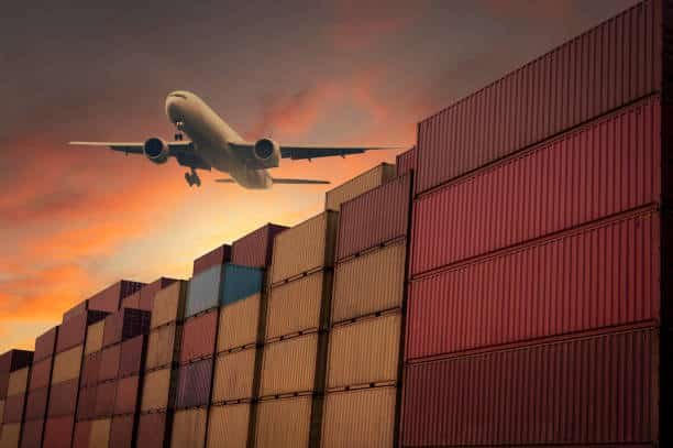 Airplane flying over cargo containers from China to Senegal