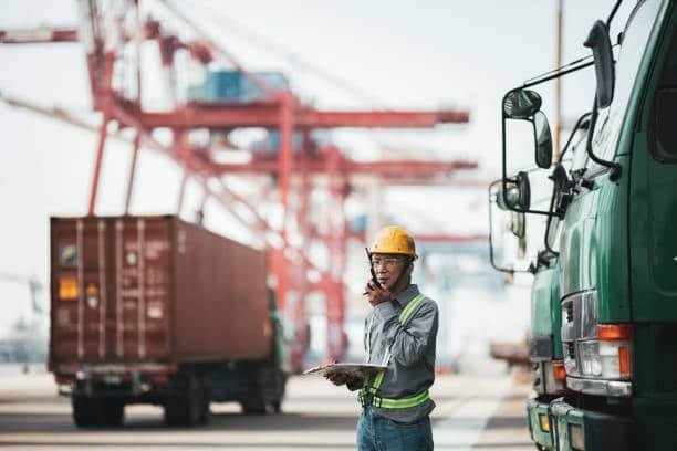 Port supervisor coordinating Alibaba container logistics at dock