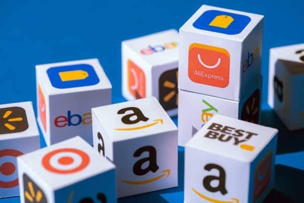 Stacked cubes with logos of AliExpress, Amazon, Best Buy, eBay, and Target
