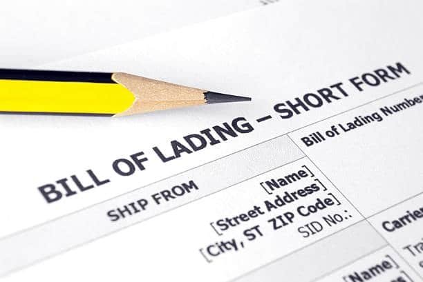 Close-up of pencil on shipping form labeled bill of lading with blank fields