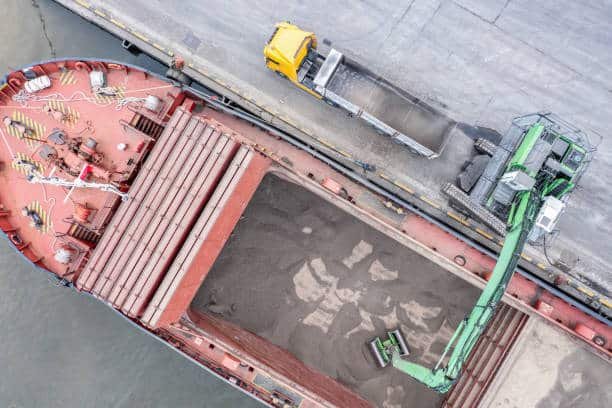 Aerial view of a ship being loaded with bulk materials for export from China to Mauritania