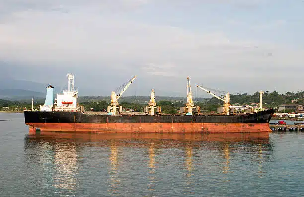 Large cargo ship anchored at Costa Rican seaport for loading and unloading operations