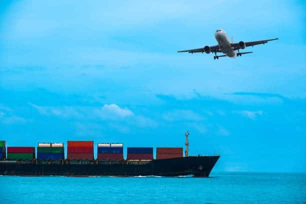 Airplane and cargo ship against a blue sky, representing international freight to Hungary.