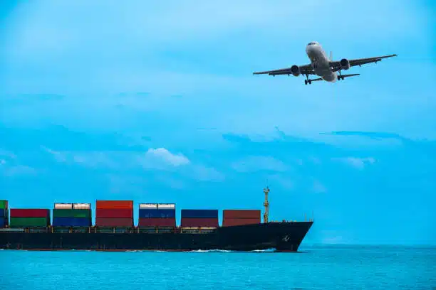 Airplane and cargo ship against a blue sky, representing international freight to Hungary.
