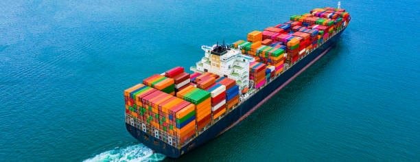 Fully loaded cargo ship departing for Singapore