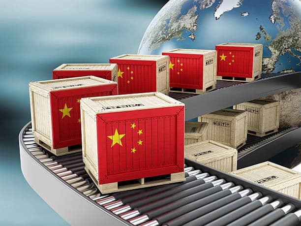 Crates with Chinese flag moving along global export conveyor
