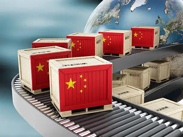 Crates with Chinese flag moving along global export conveyor