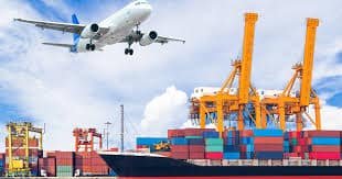 Airplane flying above port cranes and container ship, representing multimodal freight from China to Hong Kong.