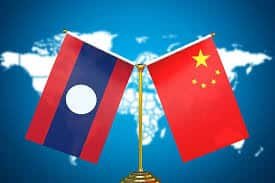 National flags of China and Laos symbolizing trade relations and cross-border shipping.