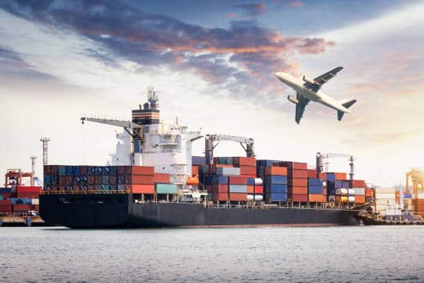 Cargo ship and airplane in port representing international shipping from China to Colombia