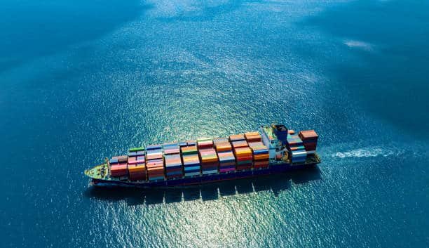 Cargo ship sailing from China to Libya with multicolored containers