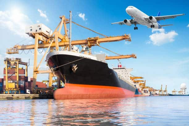 Cargo vessel at international port with airplane flying above – visualizing global freight logistics from China to Turkey.