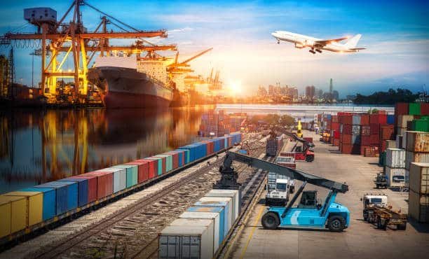 International shipping hub showing containers, ship, rail, and airplane for freight from China to UK