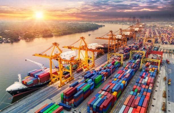 Container terminal with cranes loading cargo for export