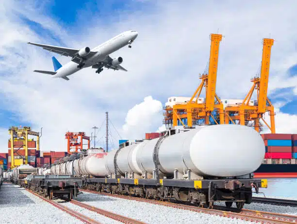 Tanker train and airplane at a busy port exporting goods from China to Greece