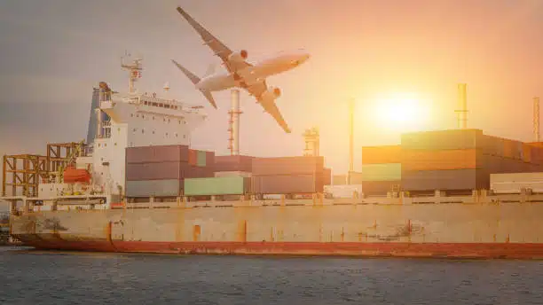 Large cargo vessel and aircraft in motion, representing international freight from China to Hungary.