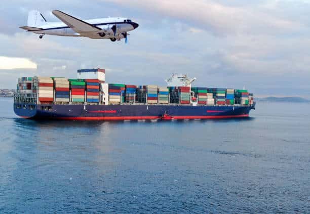 Large container ship and vintage airplane representing traditional and modern shipping from China to Mexico.