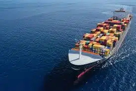 Large container ship transporting goods from China to Hong Kong across the South China Sea.