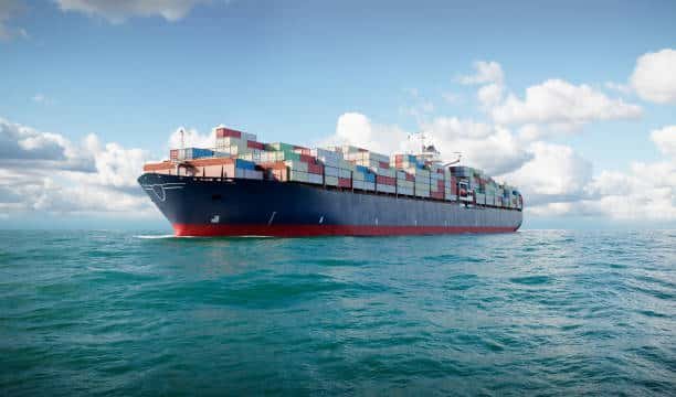 Cargo vessel on open sea transporting full container load shipments to Tunisia from China