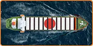 Aerial view of a cargo vessel sailing from China to Japan with national symbols.