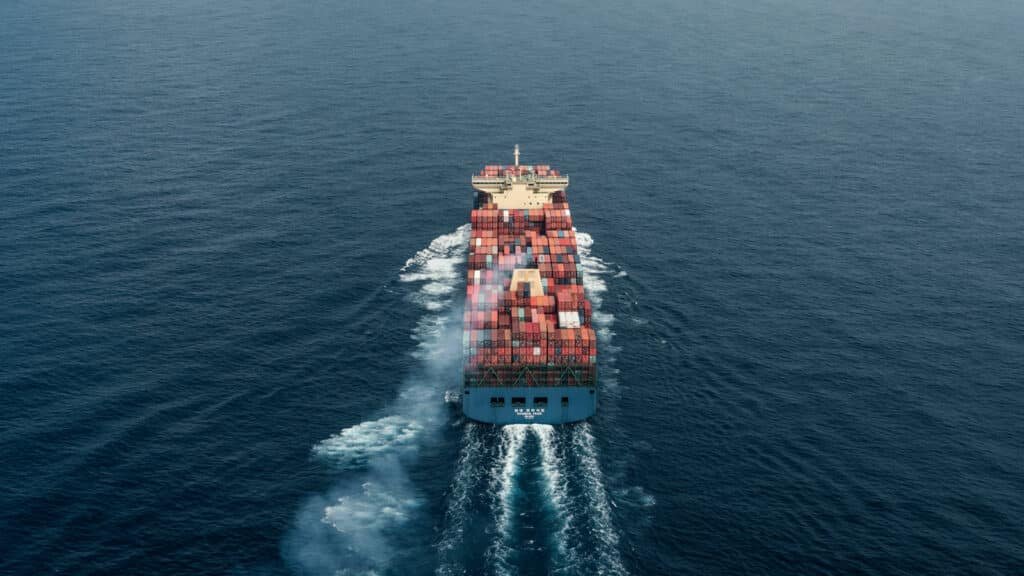 Container ship sailing in open sea representing international sea freight from China to Sri Lanka