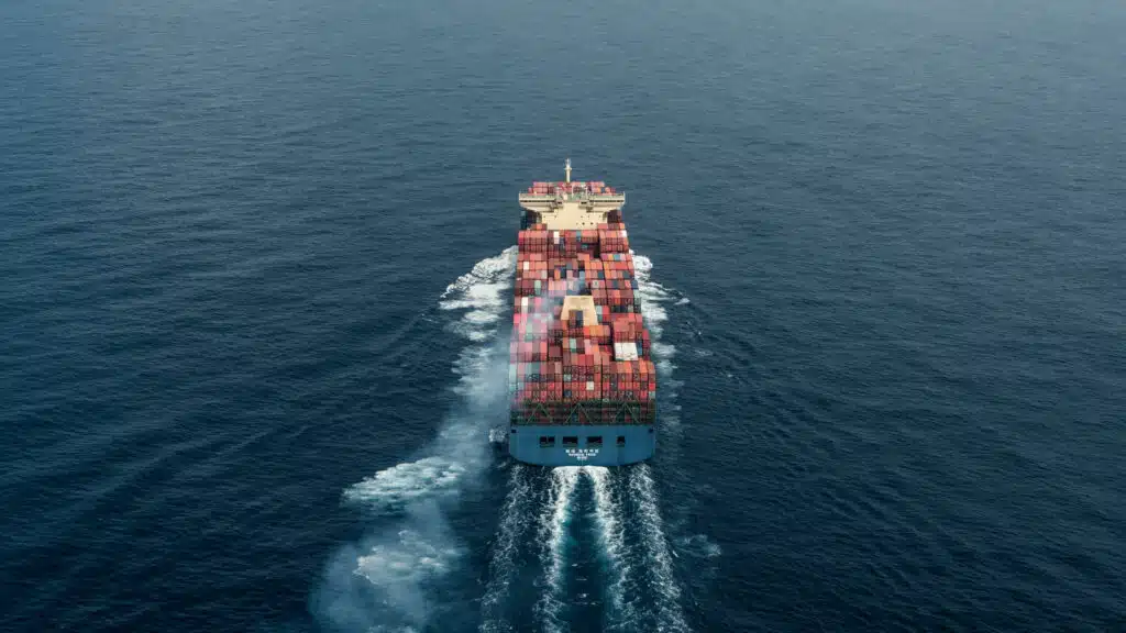Container ship sailing in open sea representing international sea freight from China to Sri Lanka