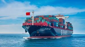 Container ship flying Chinese flag, transporting goods from China to Bahrain across the sea.