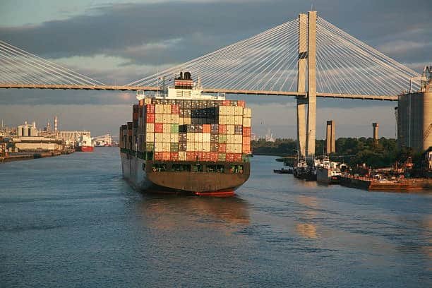 Cargo ship carrying hundreds of containers representing high TEU volume