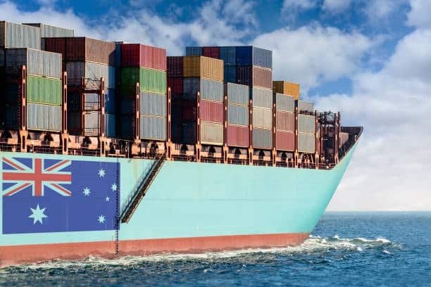 Cargo ship sailing with Australian flag painted on the hull