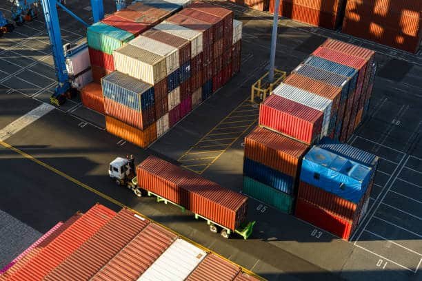 Stacked containers at a port terminal prepared for overseas export