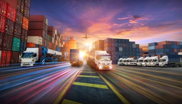 Trucks, containers, and airplanes in a busy multimodal freight terminal