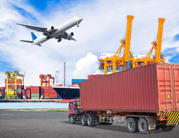 Container truck and airplane operating near seaport cranes, illustrating multimodal shipping to Pakistan